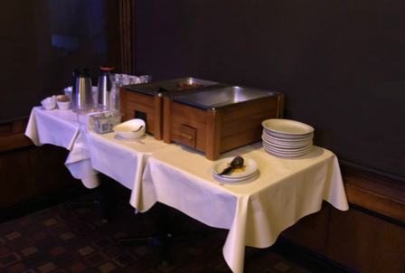 A table with plates and glasses on it

Description automatically generated with low confidence