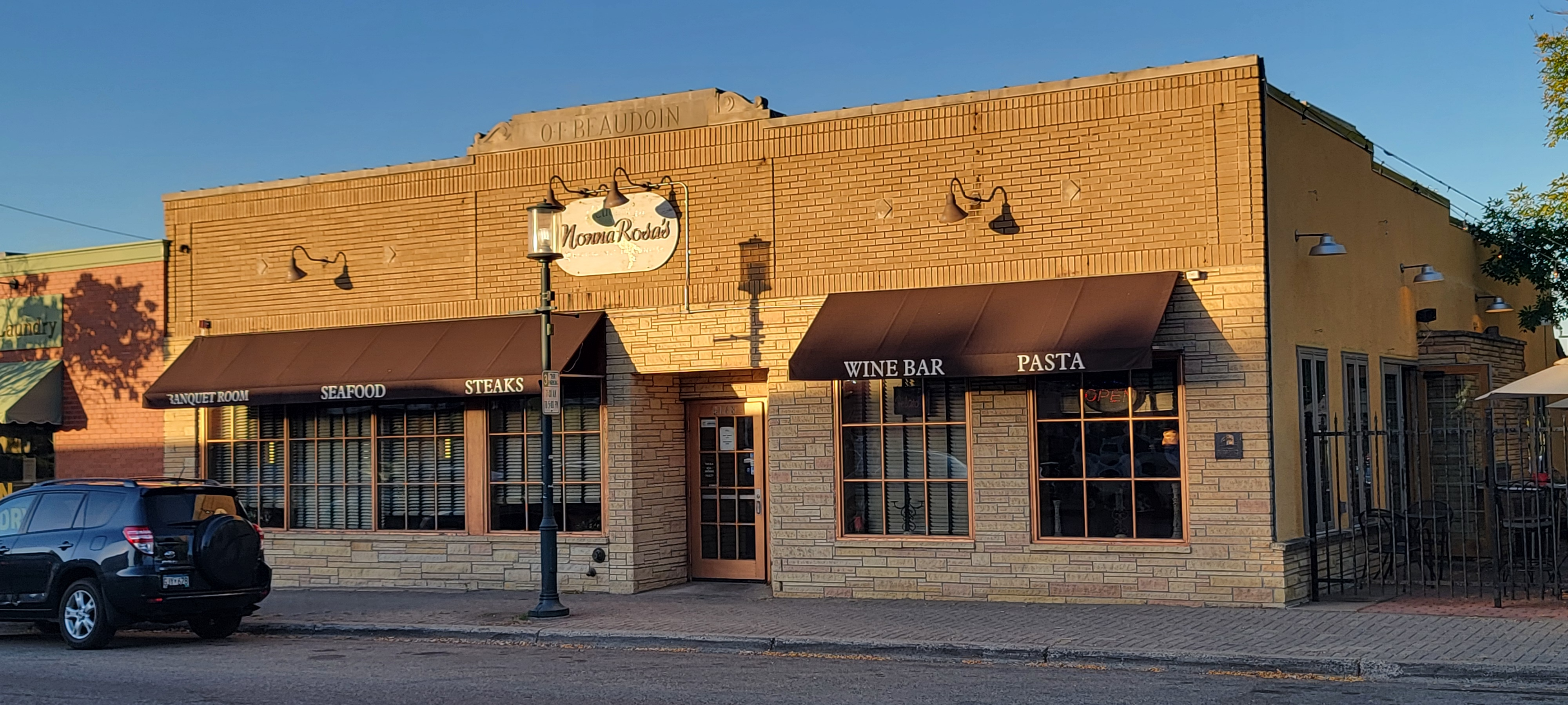 A building with awnings on the front

Description automatically generated