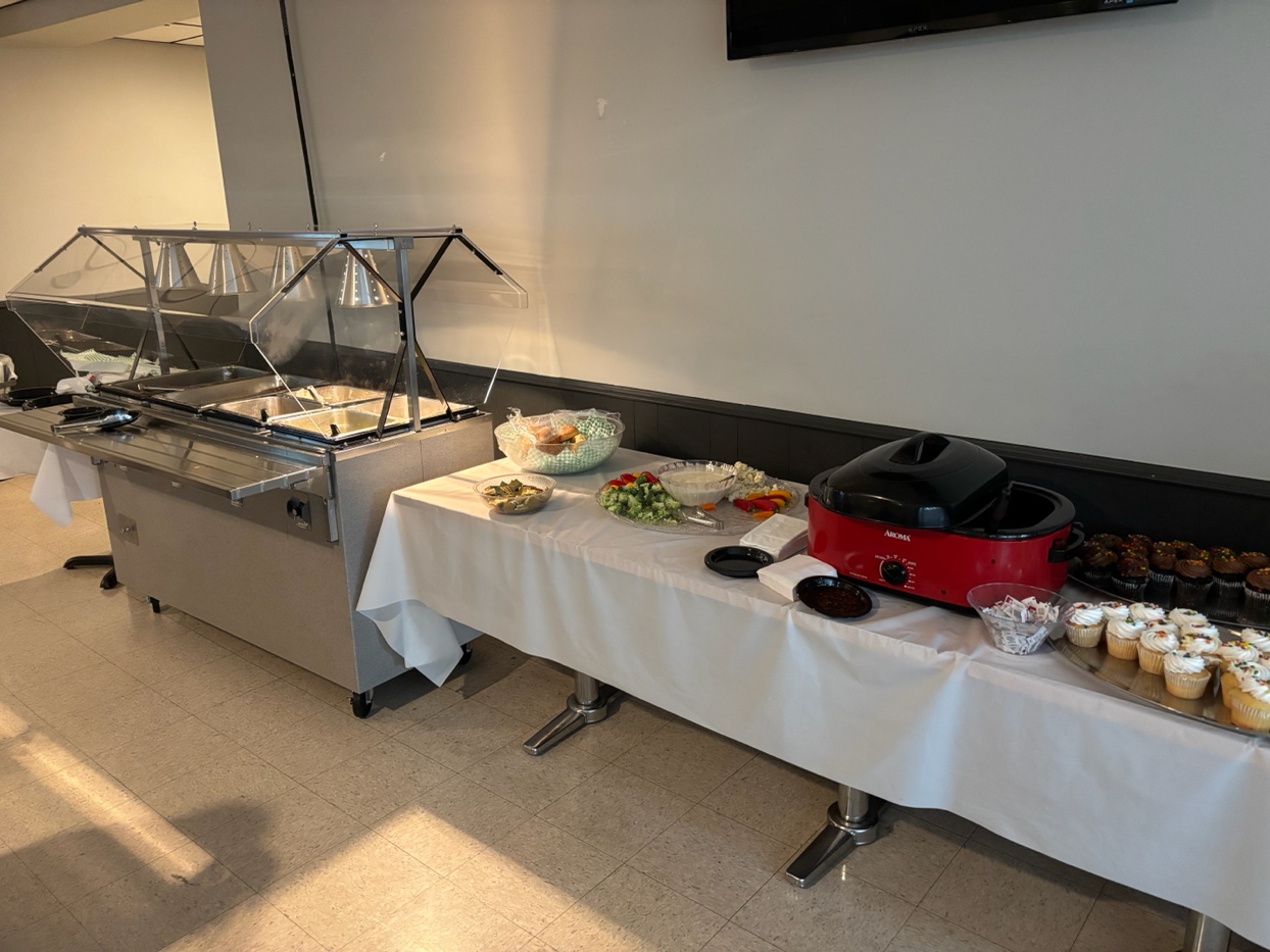 A buffet with food on a table
AI-generated content may be incorrect.