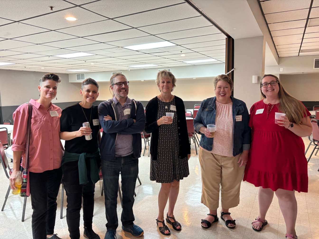 A group of people posing for a photo
AI-generated content may be incorrect.