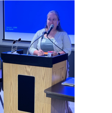 A person speaking into a microphone
AI-generated content may be incorrect.