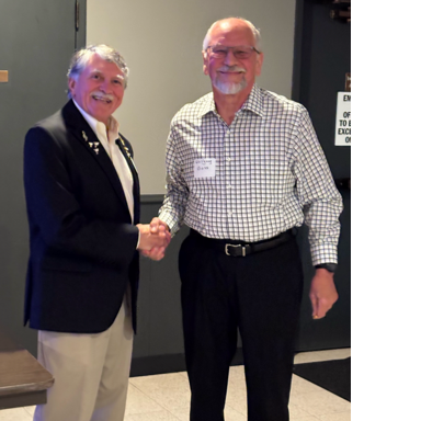 A person shaking hands with another person
AI-generated content may be incorrect.