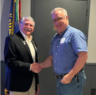 A person shaking hands with another person
AI-generated content may be incorrect.